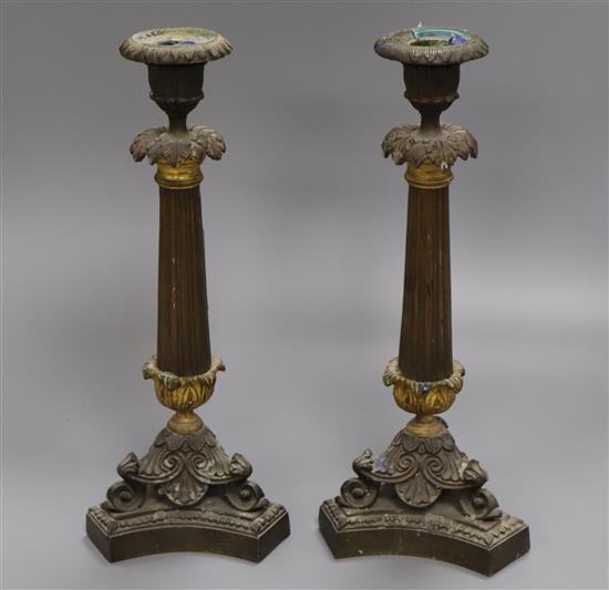 A pair of ormolu candlesticks height 30cm